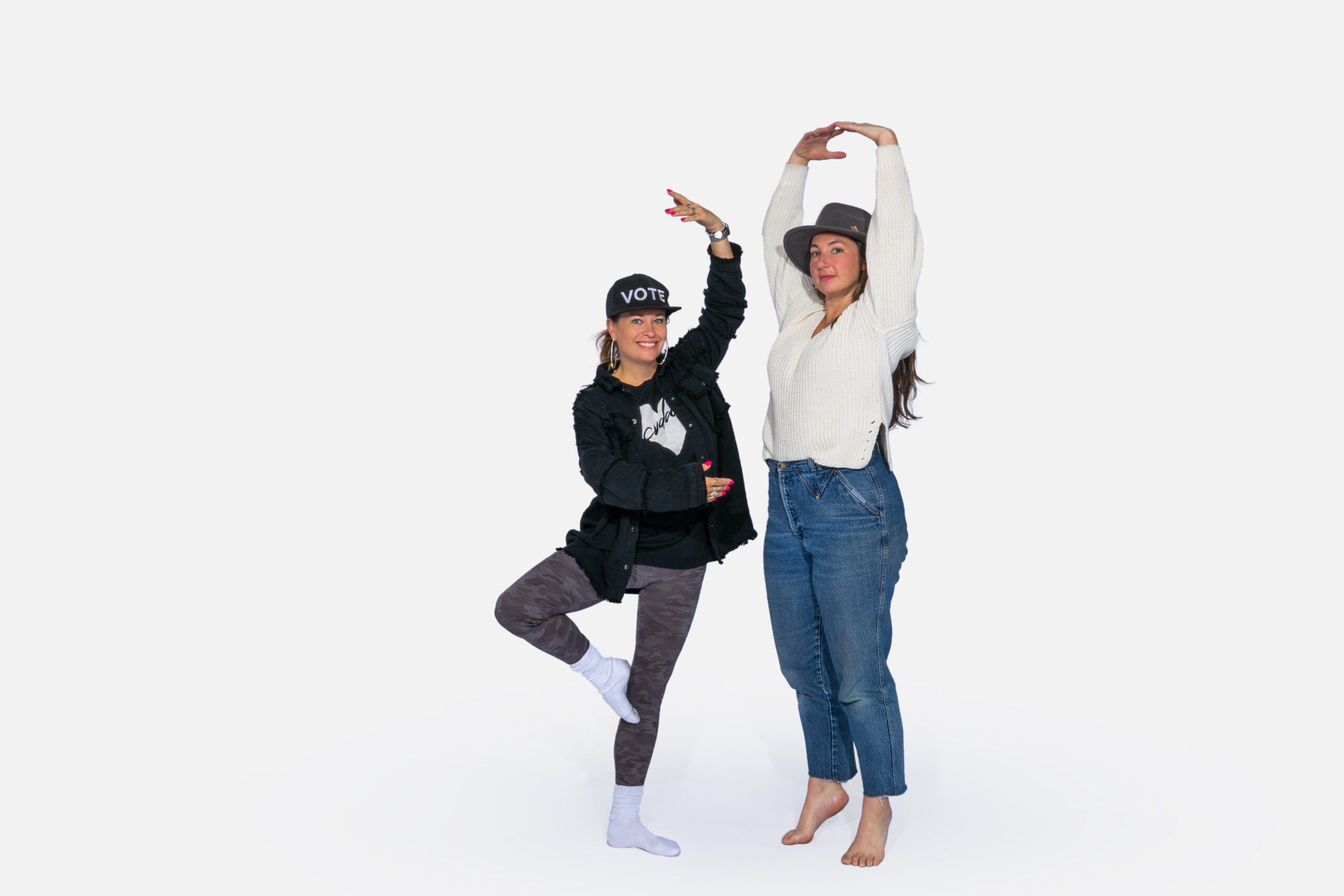 adult dancers in poses in front of a blank white background
